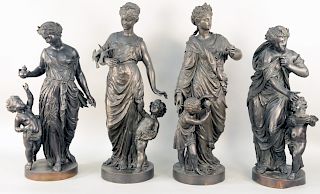 Set of Four Large Figural Bronzes of the Four Seasons, winter with shivering nymph being warmed by a brazier carried by Cupid Spring having nymph with