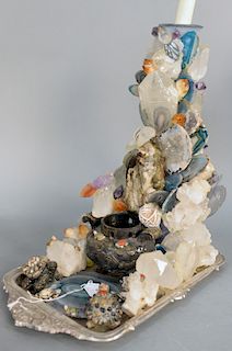 Grotto Rock Crystal Sculpture Candlestick, having amethyst, rock crystal, semi precious stones, birds and turtle figures on a plated tray in the mann