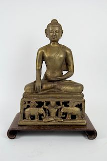 A Brass Indian Figure of Sakyamuni.