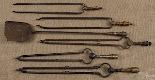 Five brass and iron fire tongs, together with a s