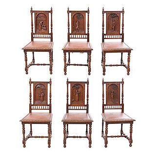 Lote de 6 sillas. Francia. Siglo XX. Estilo Bretón. En talla de madera de roble. Con respaldos cerrados y asientos tipo piel.