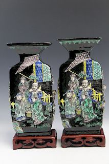 Pair of Chinese famille verte porcelain vases on wood stands, depicting eight Dao immortals, Qianlong mark.  