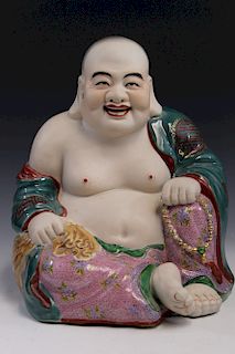Chinese famille rose porcelain figure of a laughing Buddha.