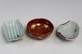 Three small Japanese porcelain dishes.