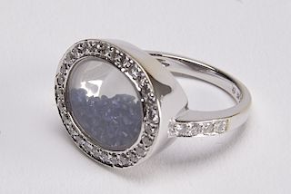 White Gold Ring with encased loose Sapphires