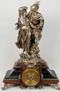 Rouge Marble and Black Slate Clock, having scrolled silvered feet, and Jean Louis Gregoire silvered bronze sculpture on top "The Rescue of Andromeda b