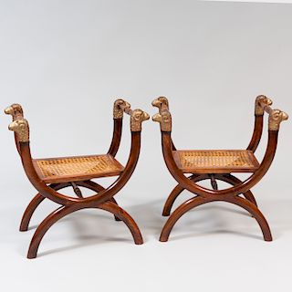 Pair of Italian Walnut, Parcel-Gilt and Caned Curule Stools