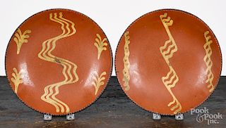 Two Pennsylvania slip decorated redware plates