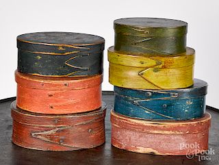 Seven painted bentwood boxes