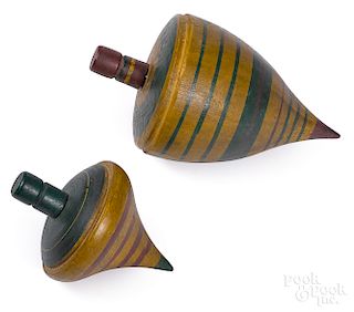 Two turned and painted spinning tops