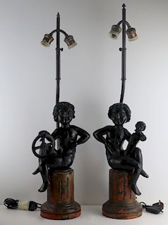 Pair of Italian Carved Puttis Mounted as Lamps.