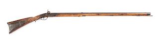 (A) FINE AS FOUND RELIEF CARVED PERCUSSION KENTUCKY RIFLE ATTRIBUTED TO JOHN NOLL.