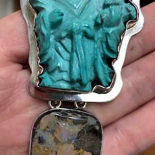 A VINTAGE TURQUOISE CHINESE FIGURE SILVER PENDANT. AKR? MARK