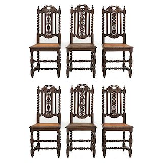 Lote de 6 sillas. Francia. Siglo XX. En talla de madera de roble. Con respaldos semiabiertos y asientos de bejuco.