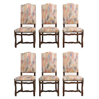 Lote de 6 sillas. Francia. Siglo XX. En talla de madera de roble. Con respaldos cerrados y asientos en tapicería multicolor.