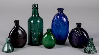 Seven early blown glass bottles and flasks