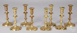 Set of eight Newport brass candlesticks