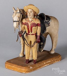 Carved and painted horse and cowgirl