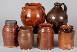 Five redware crocks and an ovoid jug