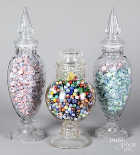 Glass jar with marbles and a pair of candy jars