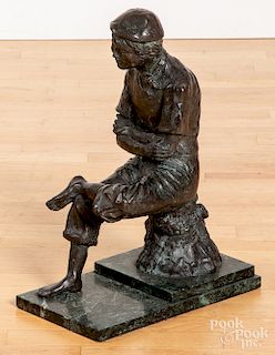 Bronze of a seated young man