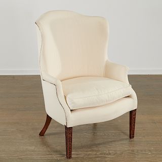 Hepplewhite style carved mahogany wing chair