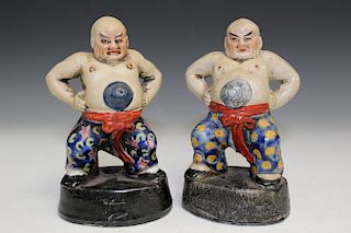 A Pair of Chinese Porcelain Wrestler Figurines, Marked.