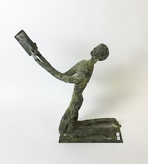 Sculpture of a Man With Book