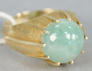 14K gold ring with round cabochon cut jadeite, stone diameter 12.2 millimeters. size 8 1/2.