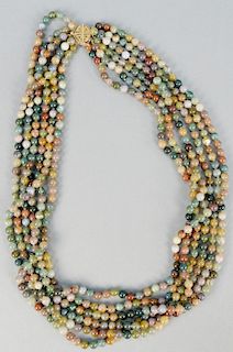 Beaded necklace, six strands with 14K gold clasp.