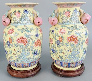 Pair of Chinese porcelain peach vases, having molded peach handles, painted with blossoming flowers, ht.12 in.