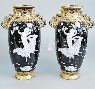 Pair of 20th century Minton style porcelain vases, pate-sur-pate with butterflies and puttis, ht. 13 in.