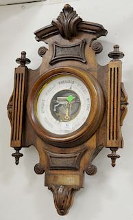 English barometer with carved case, marked "Au Chalet, Paris". 27 1/2 in. x 17 1/2 in.