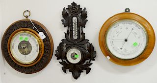 Three barometers, Sturm Veranderlich with carved walnut frame, round carved oak, marked "R. Petitpierre Wiesbaden"and round barometer marked Recumur. 