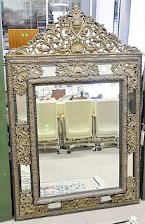 Baroque style mirror, with embossed brass. ht. 63 in., 40 1/2 in.