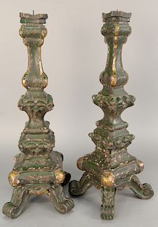 Pair of Venetian style carved parcel gilt green painted pricket candlesticks. ht. 26 1/2 in.