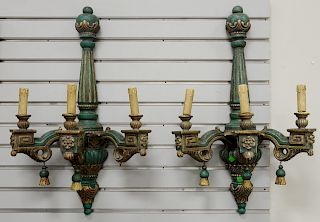 Set of four Italian Neoclassical three light sconces, painted carved wood and gilt decorated, ht. 28 in., wd. 17 in.