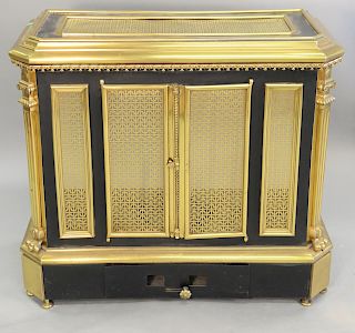 Brass and metal stove, with grill work brass doors, 19th Century. ht. 33 in., top: 15" x 36".
