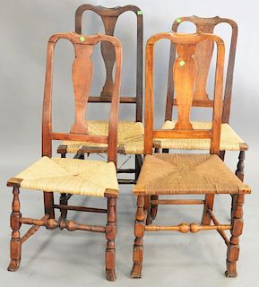 Four Queen Anne side chairs, each with rush seats over Spanish feet, 18th century. heights 39-42 in.