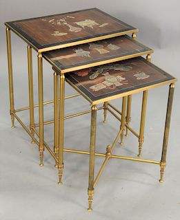Nest of three brass tables, having Chinese panel tops. ht. 22 in. top of largest 14" x 19".
