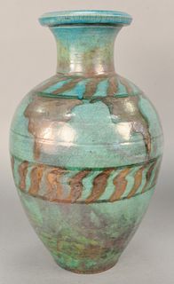 Large pottery urn, green glazed with silver designs monogram marked on bottom, ht. 18 1/4in.