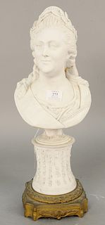 French bisque bust of an elegant woman, possibly Marie Antoinette, having floral garland in her hair on socle support on a bronze base, bust marked wi