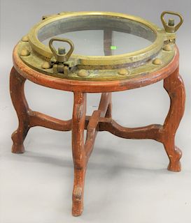 Brass ships hatch, made into a table, ht. 23 in. total dia. 22 in., glass diameter 15 1/2 in.