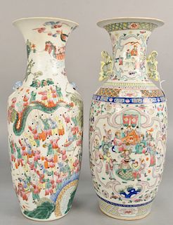 Two Famille Rose baluster vases, China, 19th/20th century, one decorated with hundred boys, dragons and lion handles, and the other with the Eight Imm