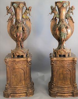 Pair of monumental metal orientalist style urns with figure on large gilt pedestal bases, urns marked L. Hottot. total ht: 77" vase ht: 46" top: 23 1/