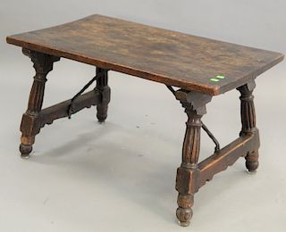 Spanish Walnut Low Folding Table, having iron supports and slab top, 16th century to early 17th century, height 18 in., top 19 x 32 in.