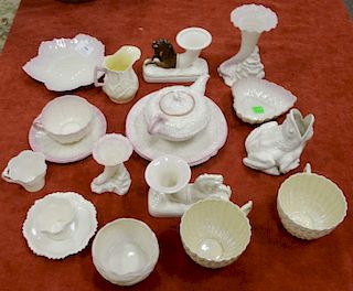 Large group of Belleek to include a frog, cornucopia vase, cups and saucers, creamer and sugar servers, ect.
