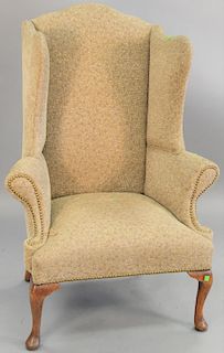 George I Queen Anne style walnut upholstered wing chair, ht. 49 in., wd. 35 in.