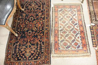 Six piece rug lot to include blue Sarouk Oriental throw rug, 2' 7" x 4' 9", along with three bag face rugs 1' 10" x 2' 5", 16 6" x 1' 10", 1' 6" x 2",