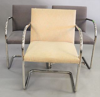 Three Knoll chrome armchairs.